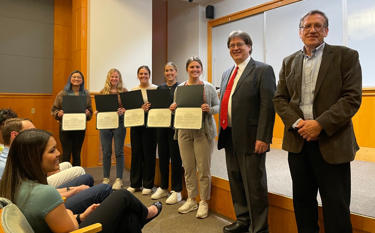 students holding certificates