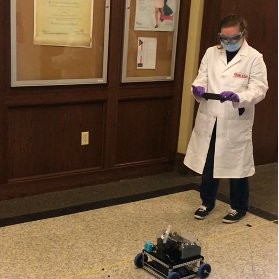 Student working on a car