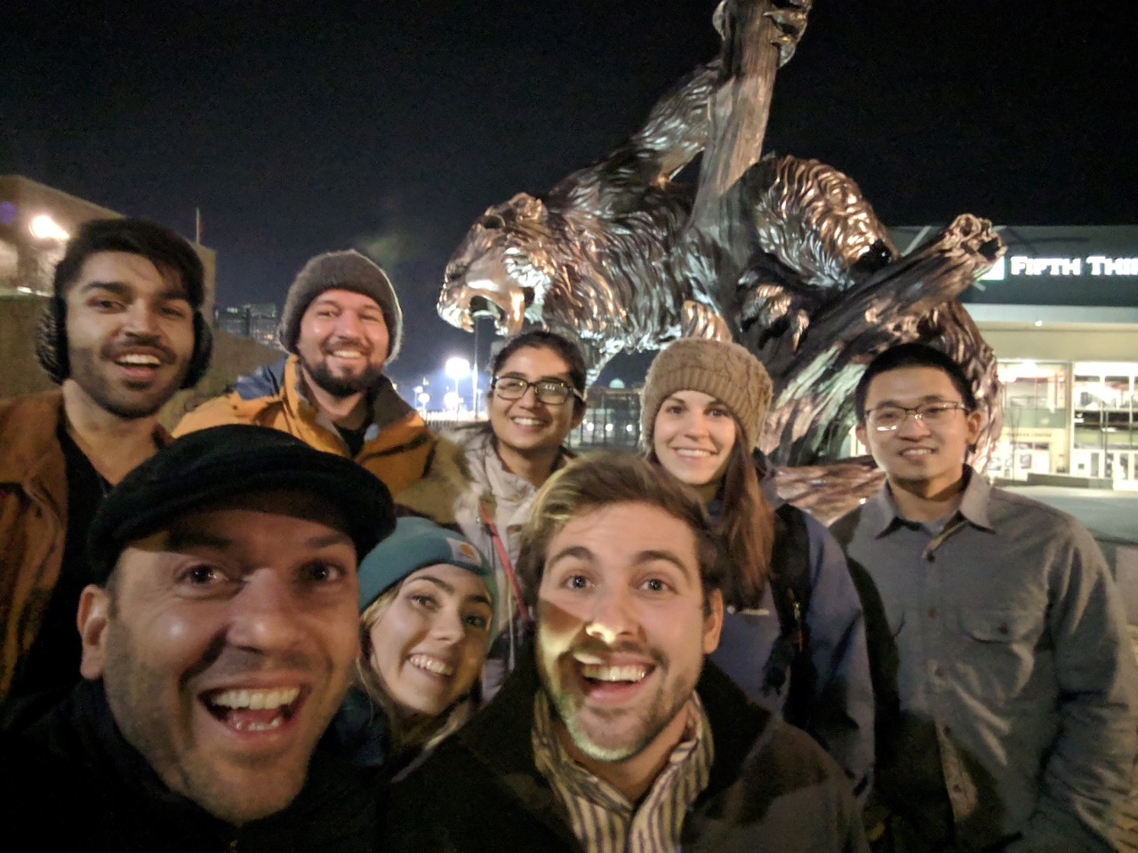 Patrick Ray Group of students in front of the Bearcat statue