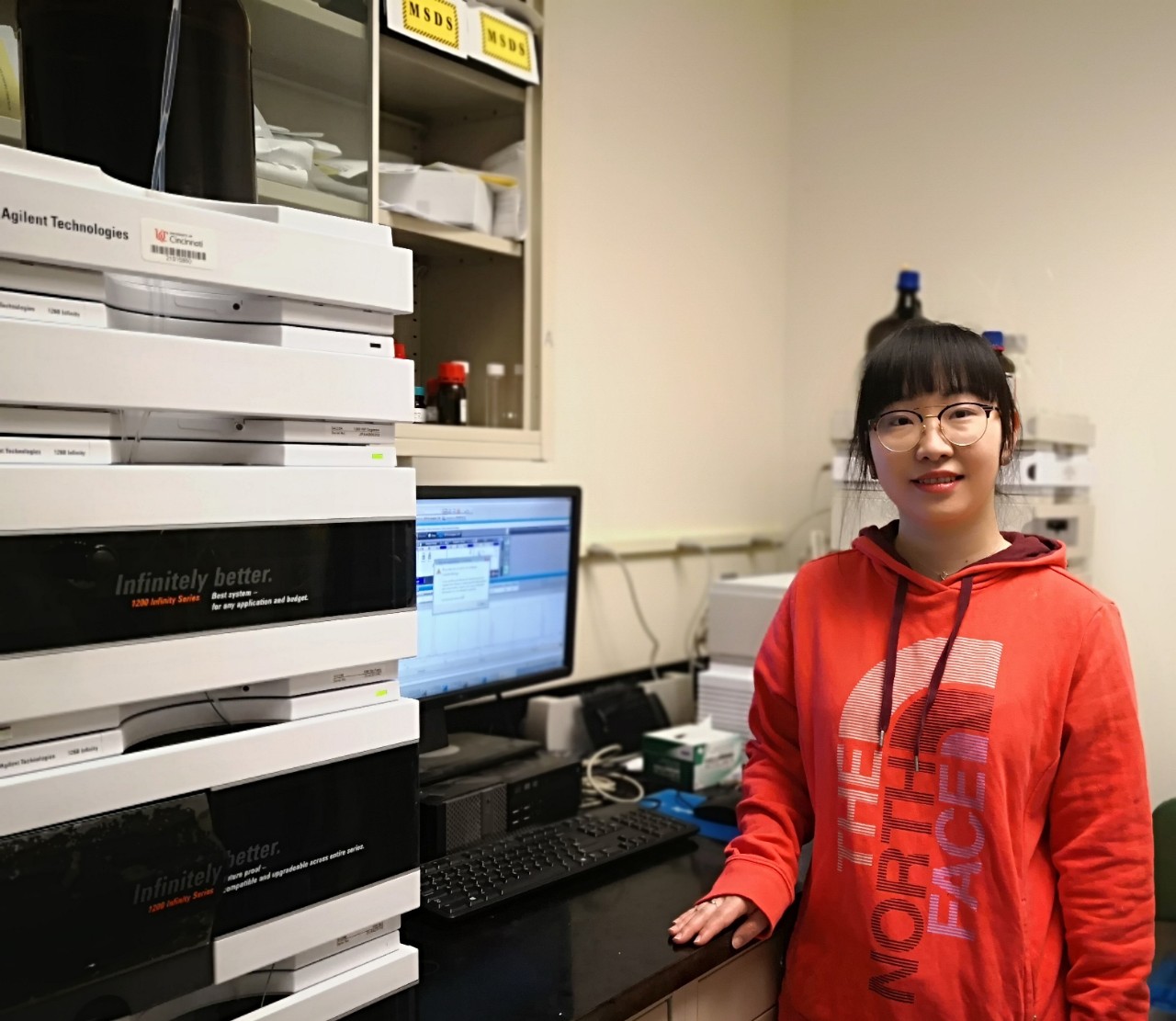 Yu Zhang using a computer in a lab