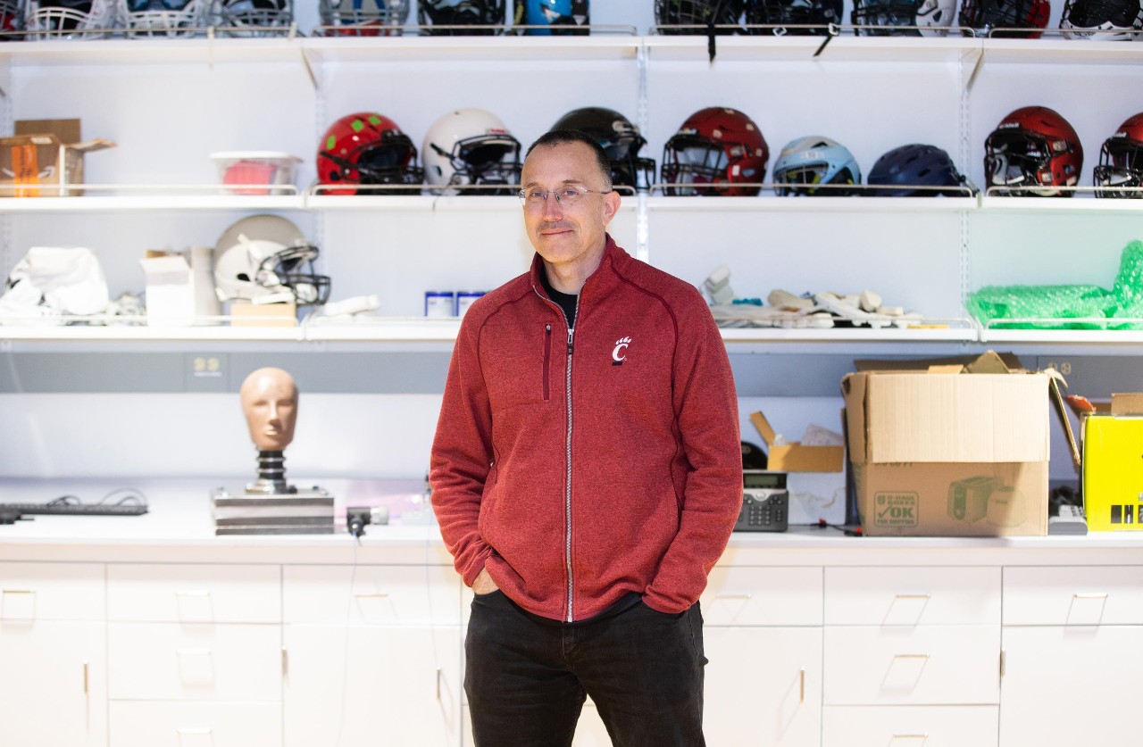 Led by Dr. Eric Nauman, a professor of biomedical engineering in UC’s College of Engineering and Applied Science, University of Cincinnati engineers put popular football helmets made by leading brands through impact testing and found that no single design demonstrated superior reduction of potential concussion incidence or consistent energy absorption at every part of the helmet. Research assistants: Sean Bucherl (ball cap), Christopher Boles (UC sweatshirt), and Shengming Hu (UC polo).