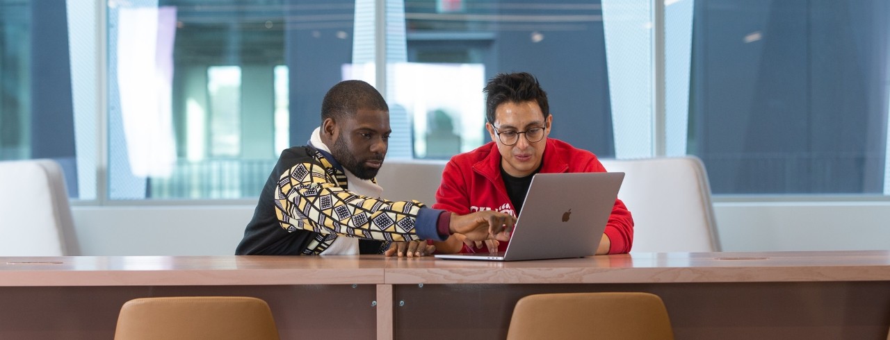 Collaboration College of Engineering and Applied Science (CEAS) graduate students pose at the Digital Futures building.